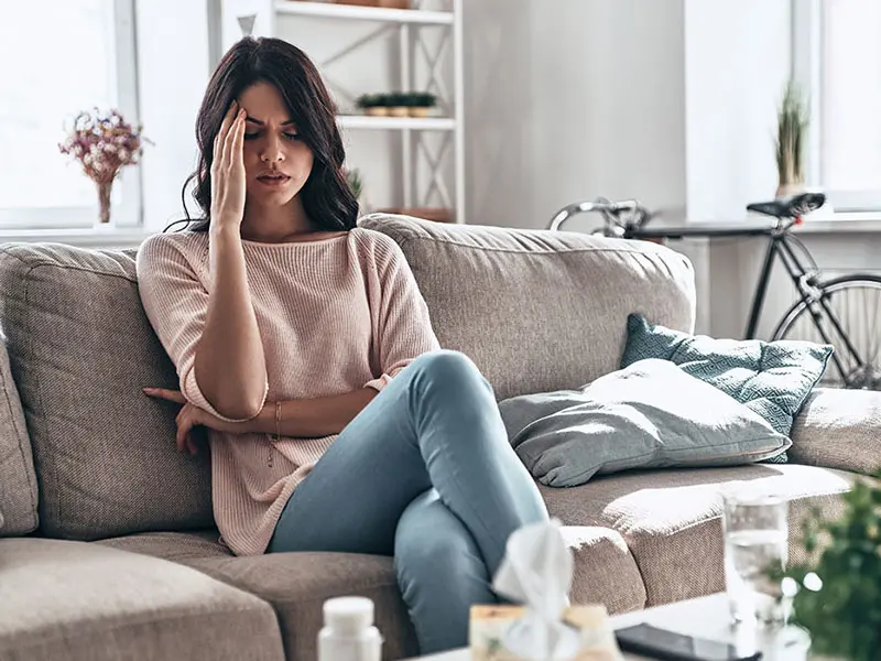 Stressed facility manager overwhelmed by maintenance tasks.